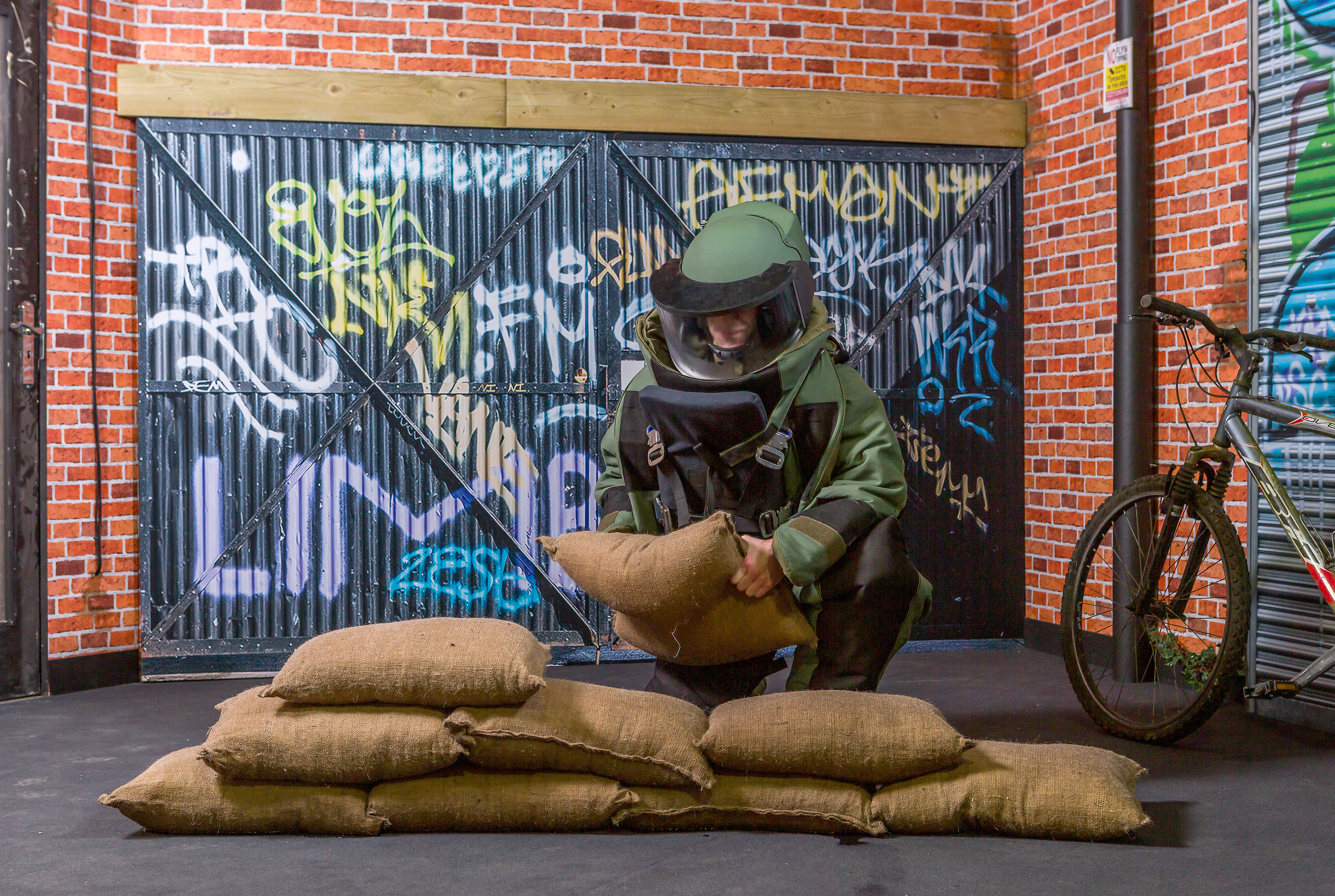 BlastSax April 2019 with soldier in protective equipment building a wall of Blastsax 2.jpg