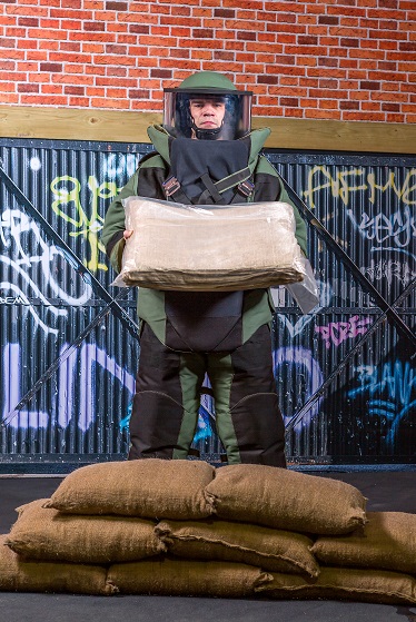 BlastSax April 2019 6 BlastSax wall with soldier in protective equipment holding BlastSax in packaging resized.jpg (1)
