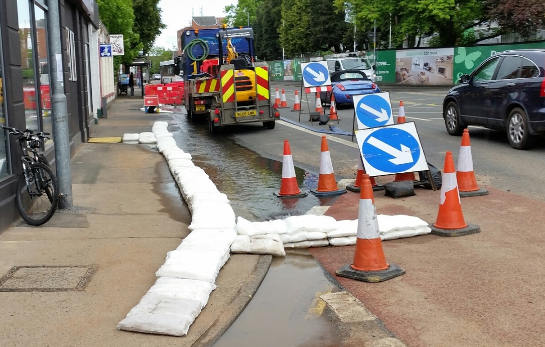 FloodSax diverting water from a burst pipe away from businesses.jpg